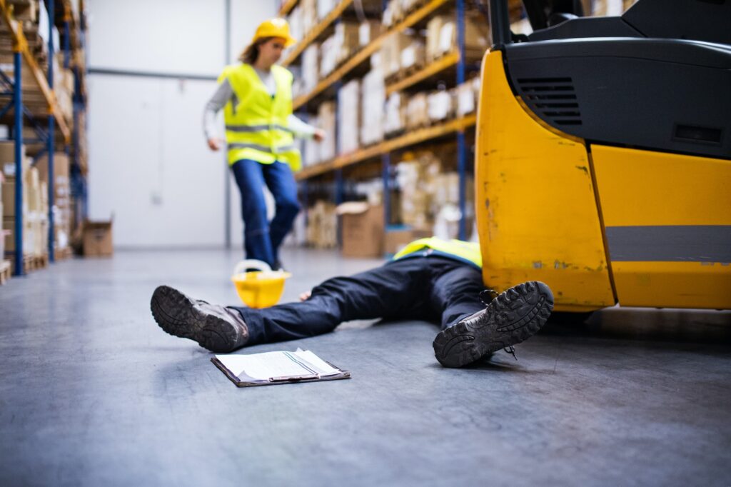 An injured worker after an accident in a warehouse.